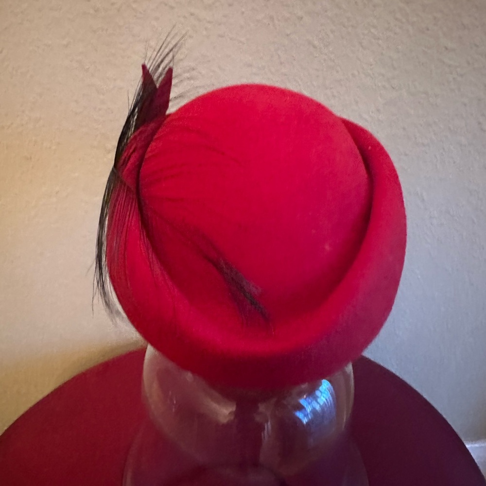 Small cranberry 100% wool hat with black feather design made in USA